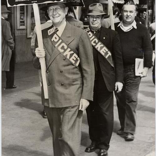 [William McFetridge, international president of the Building Service Employees Union, on a picket line at the Paramount Theater]