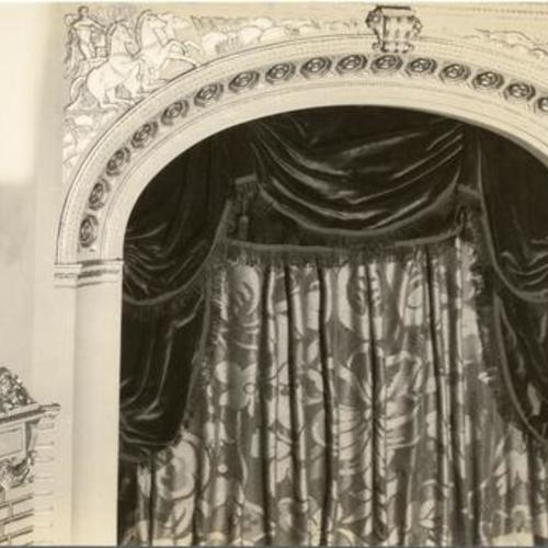[View of curtains and decorations above stage at War Memorial Opera House]