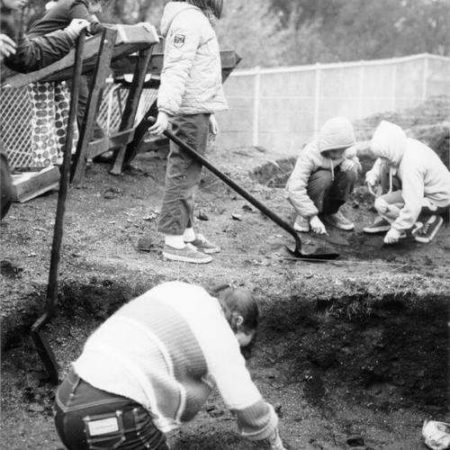 [Students from John W. Geary School digging in the ground at Miller Creek]