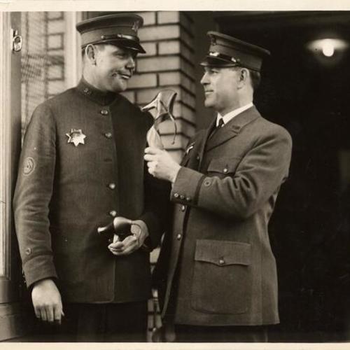 [Officer Paul McAvoy standing on left]