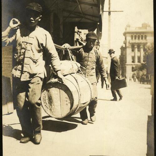 [Peddlers carrying a barrel, Chinatown]