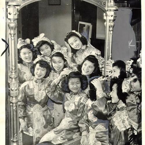 [Students at a Chinatown school wearing festive robes in preparation for reception of Mme. Chiang Kai-Shek]