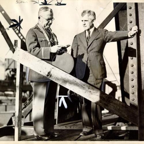 [Joseph Baermann Strauss and Major Thomas L. McKenna at Blessing of Golden Gate Bridge high up on one of the towers]
