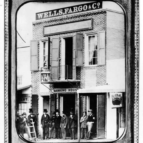 [Group of people standing in front of the Wells, Fargo & Co. building]