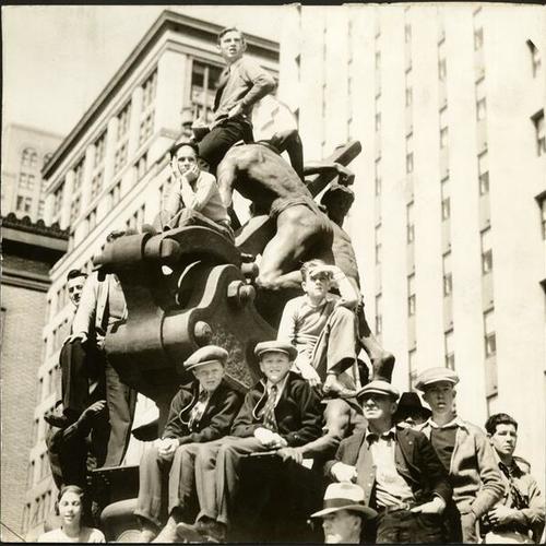 [Group of children sitting on the Donahue Monument, also known as the Mechanics Monument, on Market Street]