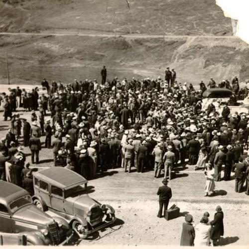 [Crowd gathered on the Marin County side of the Golden Gate Bridge during opening day ceremonies]