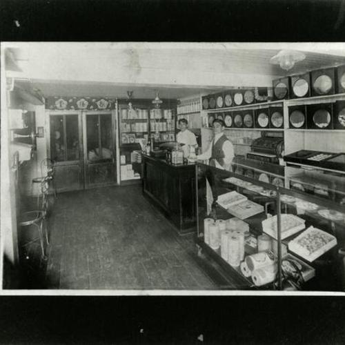[Interior of Benkyodo Candy Factory on Geary Boulevard in 1906 with Suyeichi and unknown business partner]