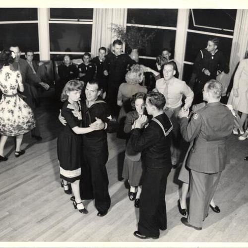 [Service men attending a dance held at hospitality house]