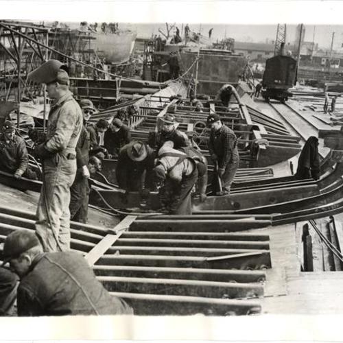 [Shipyard workers at the Defoe Shipbuilding Co.]