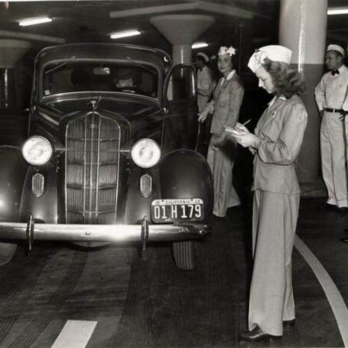 [Attendants checking cars entering the new Union Square underground garage]