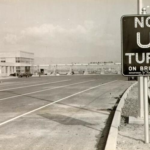 ["No U Turn" sign near the toll booths on the San Francisco-Oakland Bay Bridge]