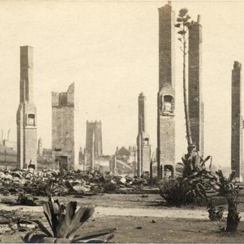 [Chimneys towering above the wreckage left by the 1906 earthquake]