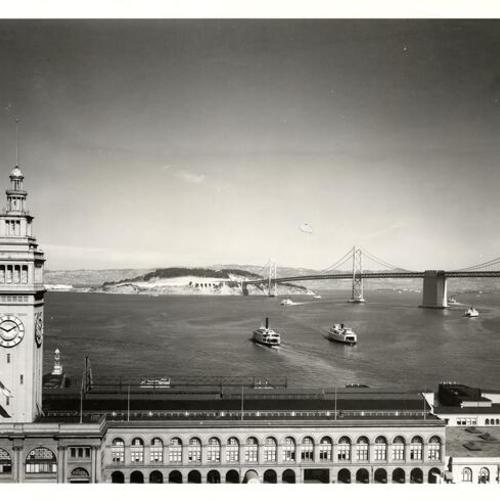 [View of Ferry Building with Yerba Buena Island and nearly completed Bay Bridge in background]
