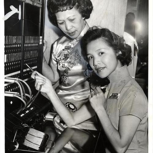 [Nora E. Wong and Gloria Wong on opening day of the first Chinese answering service in the United States]