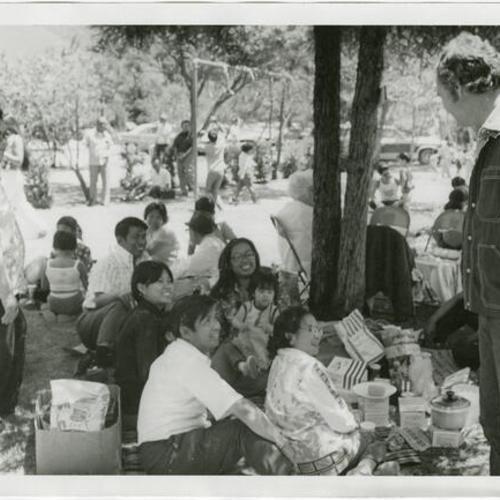 [George Moscone greeting a group of people sitting down at the Gran Oriente Filipino Masonic picnic in South Park]