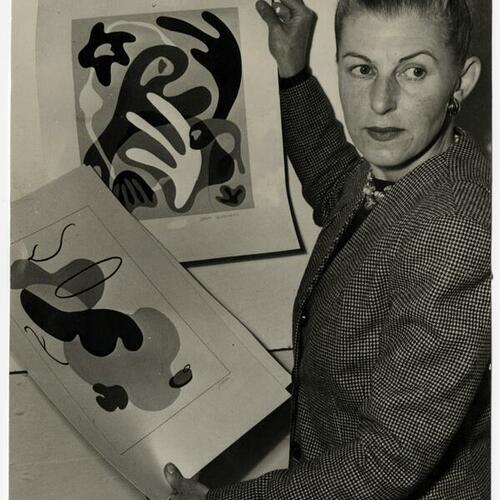 Dorr Bothwell holding two of her textile designs