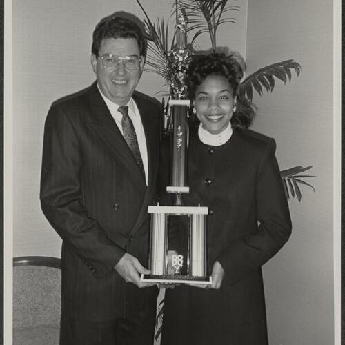 Hilton general manager Holder Gantz congratulating Cindy Herron for being named 1988 Miss Black California