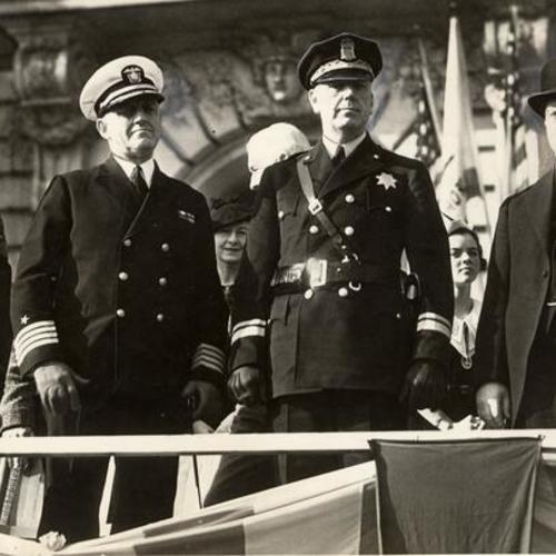 [Alfred J. Cleary (right) standing with Edward J. Sharkey (far left), Captain R. L. Chormeley and Chief Quinn on Armistice Day]