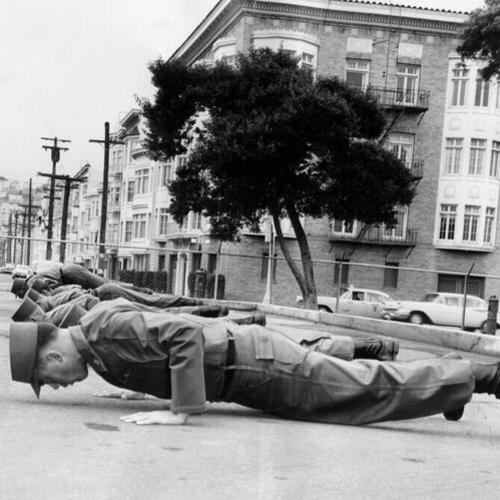 [Group of army men doing pushups a Fort Mason]