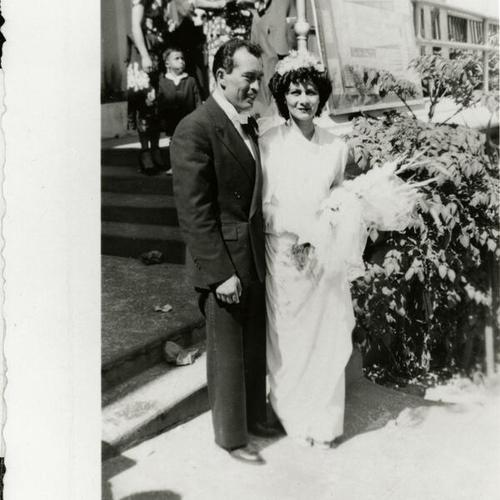 [Wedding portrait of a couple in front of Guadalupe Church]