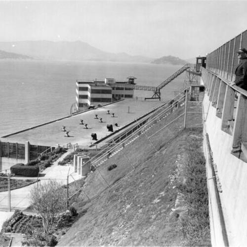 [Guard at Alcatraz Island Federal Penitentiary looking out across the bay]