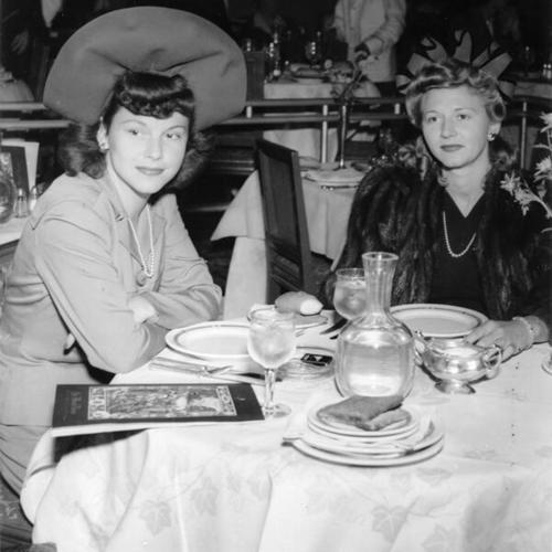 [Mrs. Leonard F. Aregger and Mrs. George Olson at the St. Francis Hotel for a Monday luncheon]