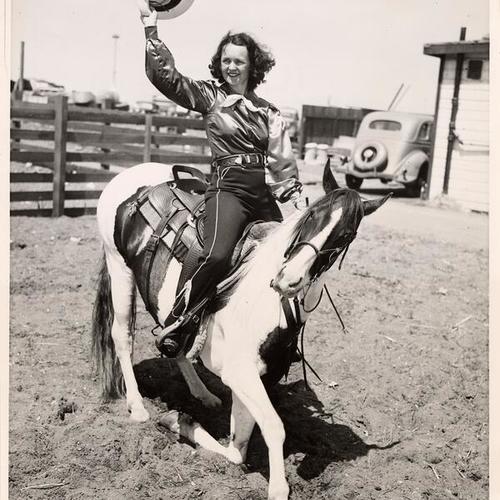 [Louise Montana and her horse "Buttons" rehearsing for their Rodeo performance on Livermore Day, Golden Gate International Exposition on Treasure Island]