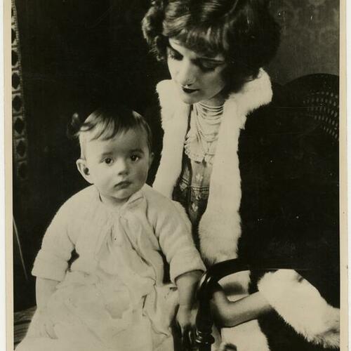Natalie Talmadge sitting with child on her lap