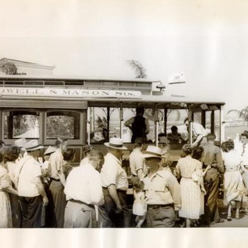 [Passengers boarding Powell Street cable car on display at Chicago Railroad Fair]