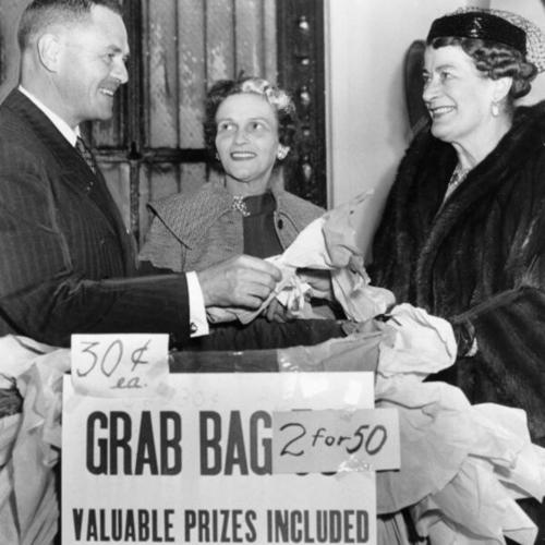 [Supervisor Francis McCarty, acting mayor, opens the Maritime Museum Salvage headquarters at 1967 Jackson St. with Mrs. Walter Baird (center) and Mrs. Siegfried Bechhold (right)]