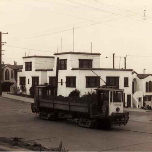 [Ortega street and 21st Avenue looking northwest at Differential Dump car 0932 with load from Ortega street sand pit]