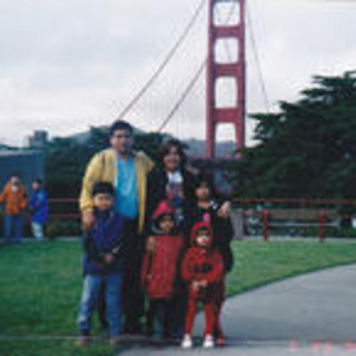 [Janice's family posing in front of Golden Gate Bridge]