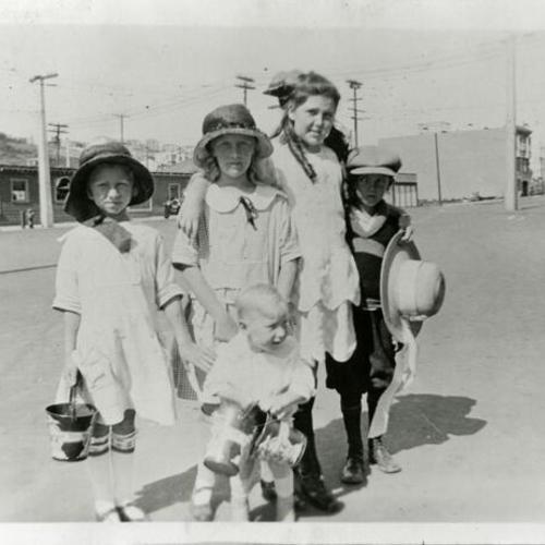 [Lorraine with friends and sand buckets on the way to Ocean Beach in 1923]