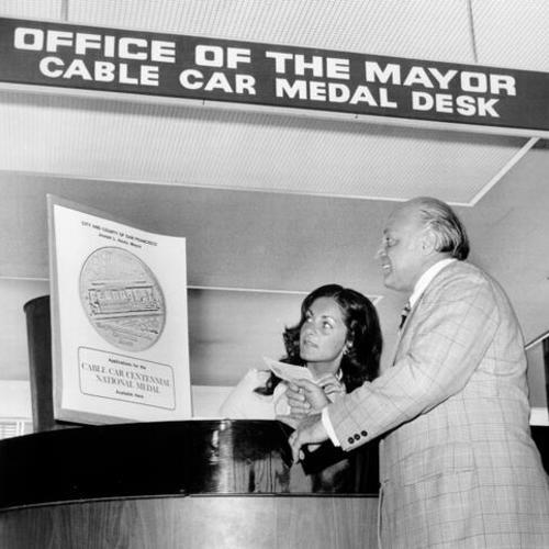 [Mayor Joseph Alioto at the Cable Car Medal Desk]