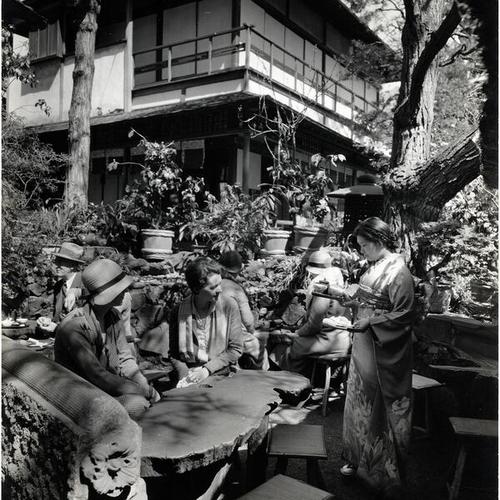 [Visitors have tea and cookies in the Japanese Tea Garden]