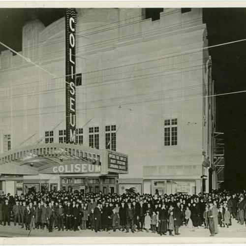  crowd of people outside of the Coliseum Theater]