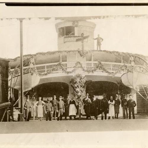 [Group of unidentified staff and men on the front deck of the "Bay City" ferryboat]