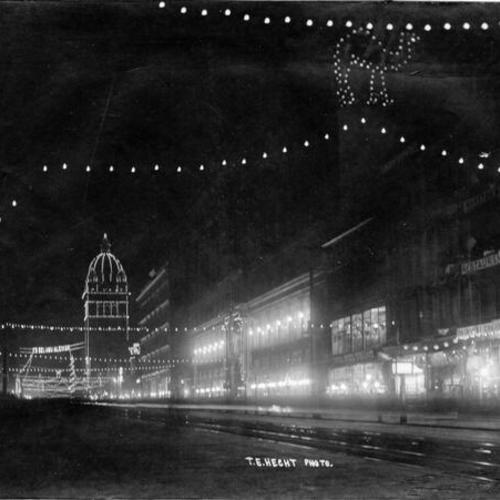[Nighttime view of illuminated decorations on Market Street, near 5th Street]