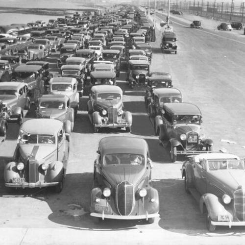 [View of lines of automobiles on opening day of San Francisco-Oakland Bay Bridge]