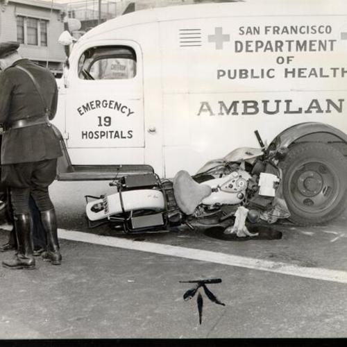 [Department of Public Health ambulance at the scene of a motorcycle accident]