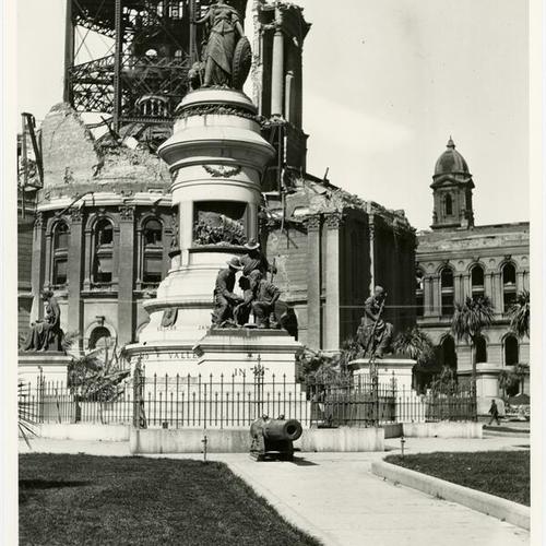 [Pioneer Monument, 1906, with City Hall ruins]